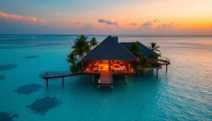 Experience luxury travel destinations with a stunning sunset over an opulent Maldives beach and overwater bungalow.